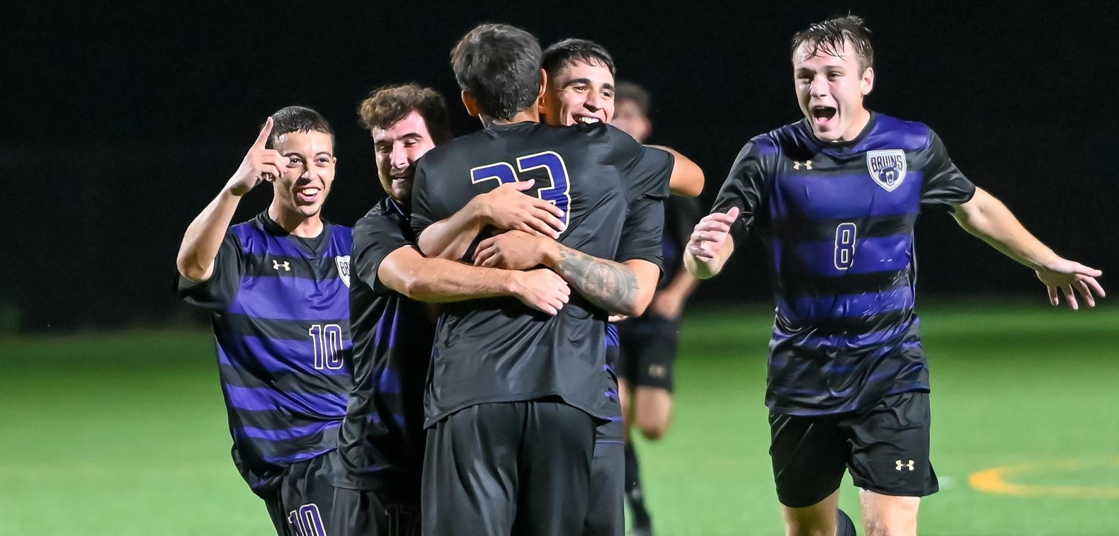 Guilherme Alencar is met by his teammates after scoring an insurance goal to put BU up 3-1 on Wednesday.