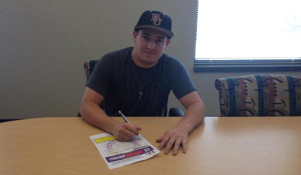 Former Millard North and New Mexico State player Matt Evans signs his letter of intent